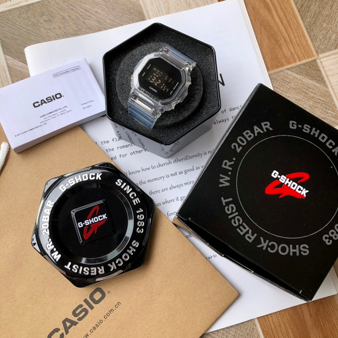Casio G-Shock watch set, clear-faced watch with black dial and protective frame