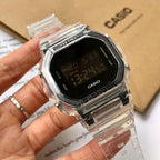 Casio watch on hand, clear strap and black digital face with Protection text