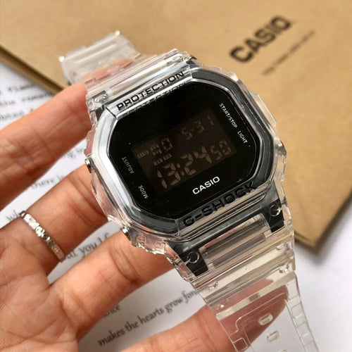 Casio watch on hand, clear strap and black digital display with Protection bezel