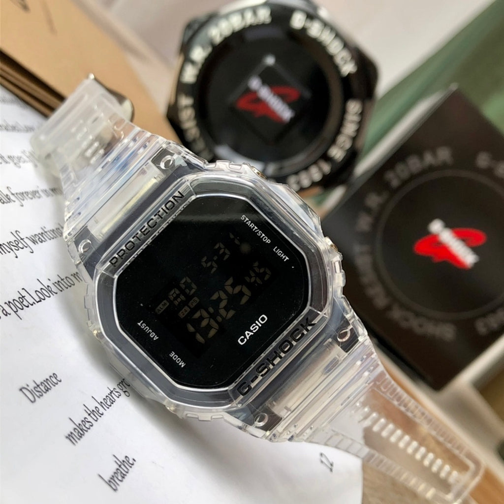 Casio watch with clear strap and black digital screen, close-up on the bezel
