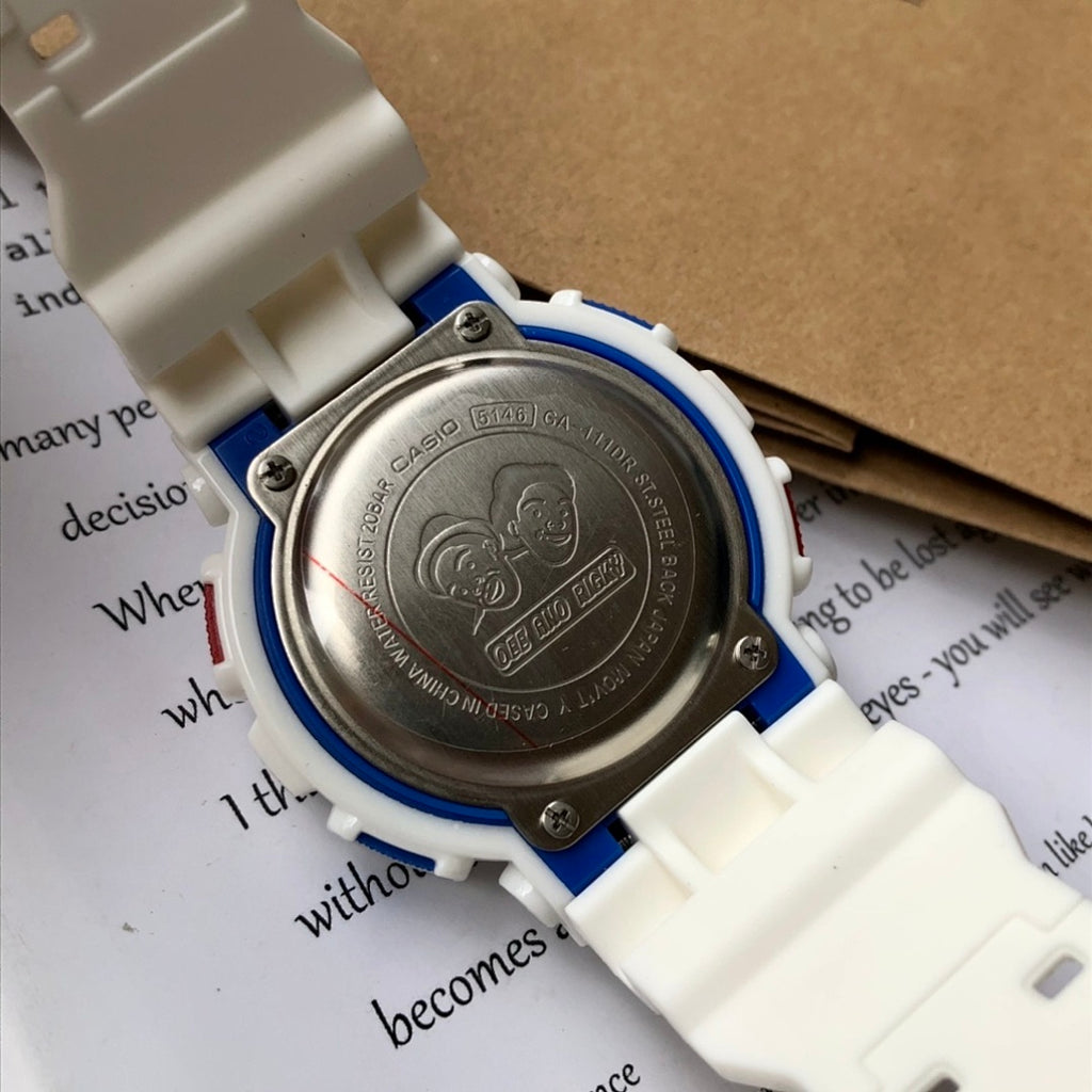 Casio G-Shock case back close-up with engraved metal plate and blue trim