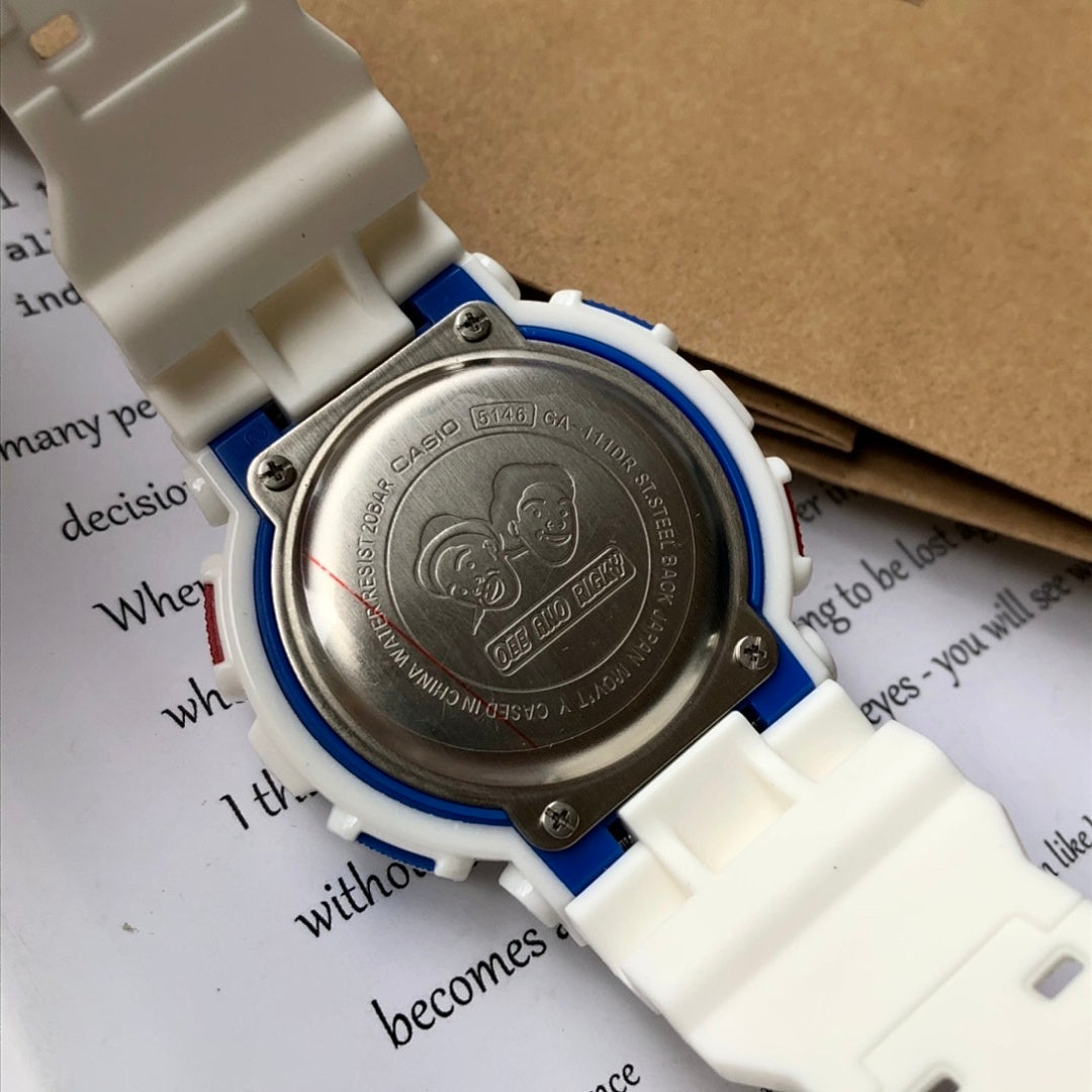 Casio G-Shock case back close-up with engraved metal plate and blue trim