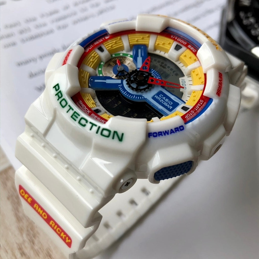 Casio G-Shock watch close-up, multicolor dial on white resin strap