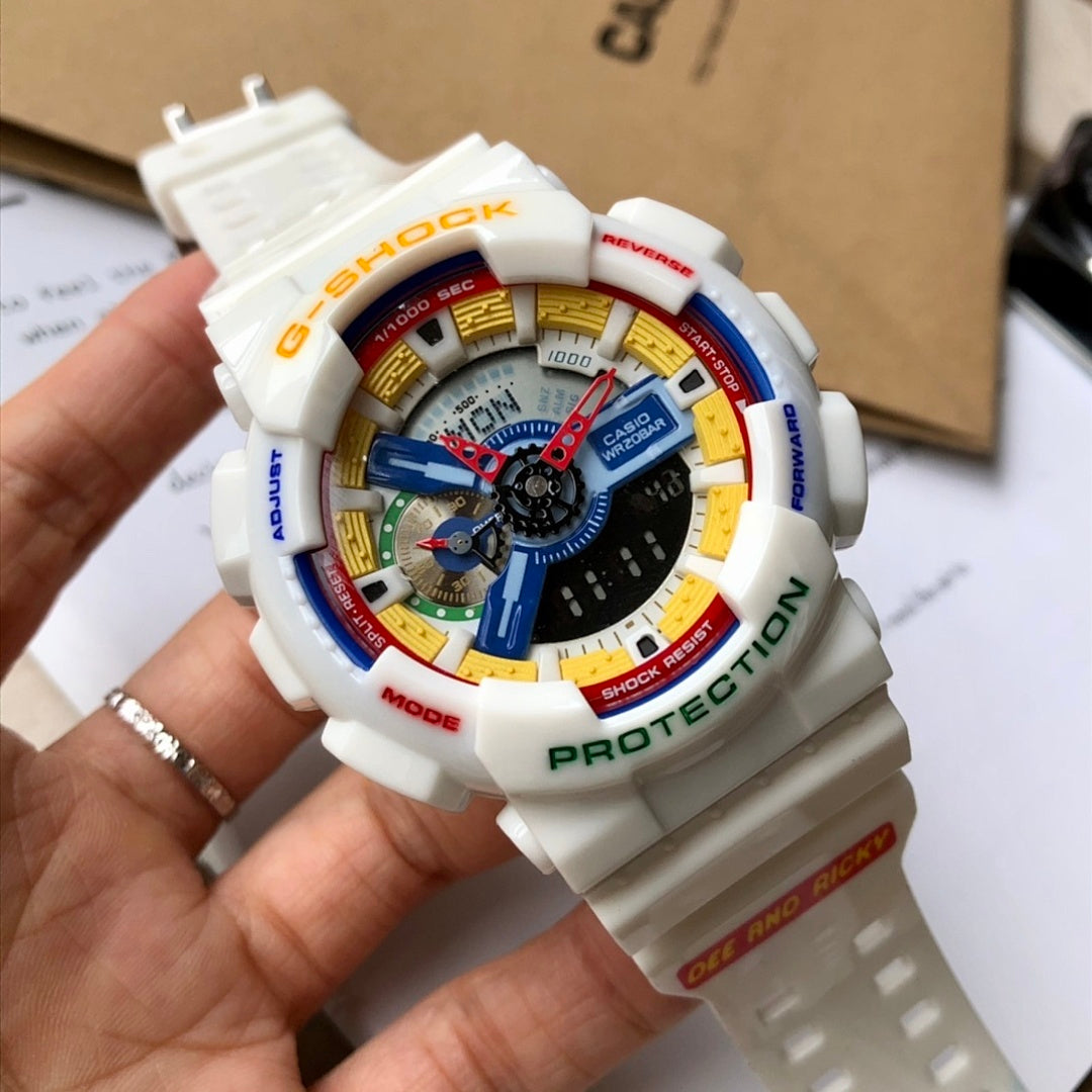 Casio G-Shock digital watch held in hand, white strap, multicolor dial