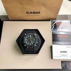 G-Shock watch on black octagonal display with black resin strap and detailed dial