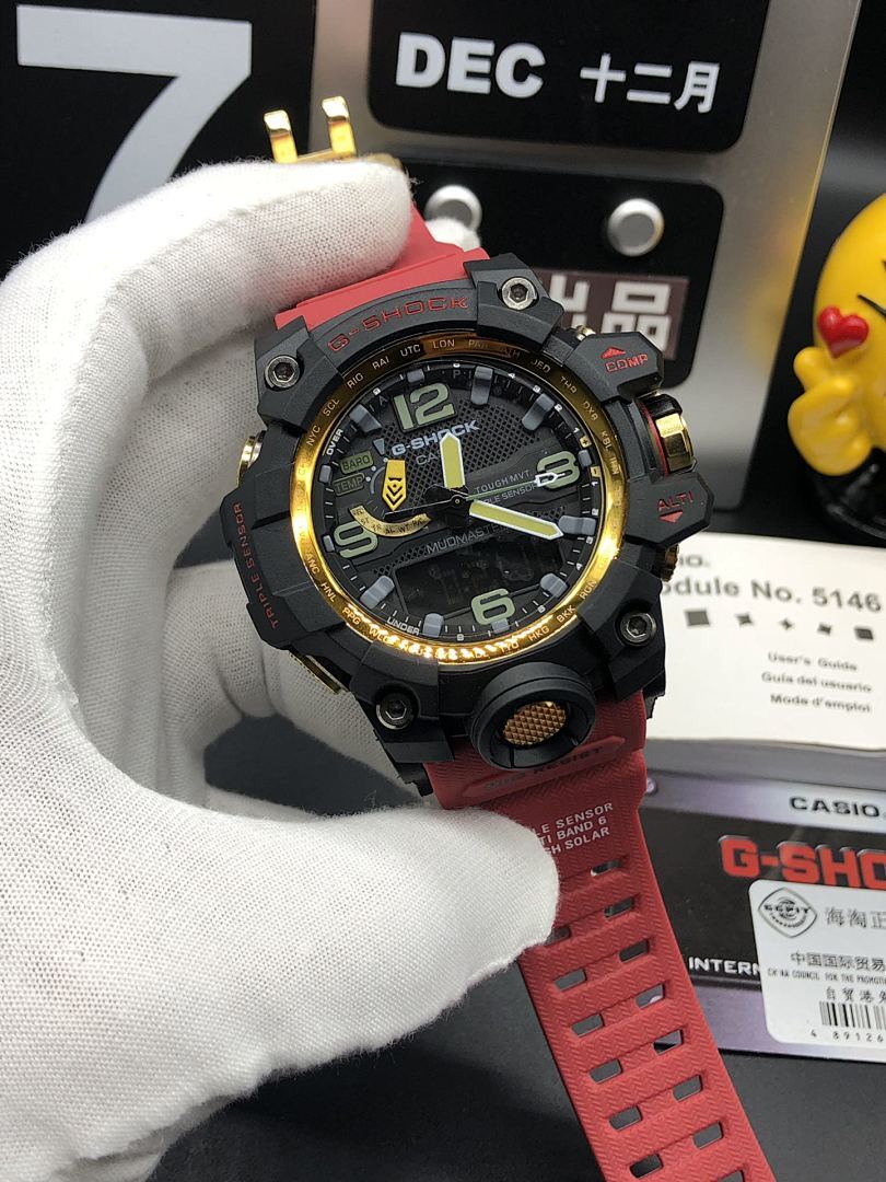 Casio sports watch close-up, black dial with yellow-green markers, red strap