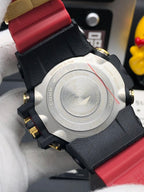Casio watch backplate with engraved details, black case back, red silicone strap