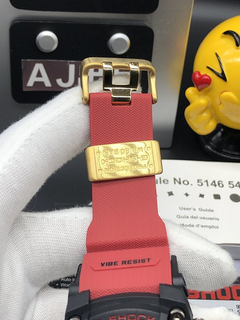 Casio watch buckle and clasp, red silicone strap with gold hardware