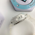 White resin watch strap with textured grip detail, close-up