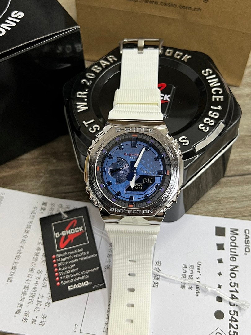 G-Shock watch with white resin strap and silver-toned case, blue dial with digital time