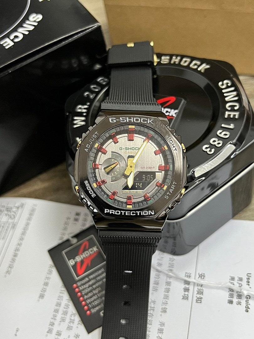 G-Shock watch with black resin strap and silver-toned case, gray dial with red highlights