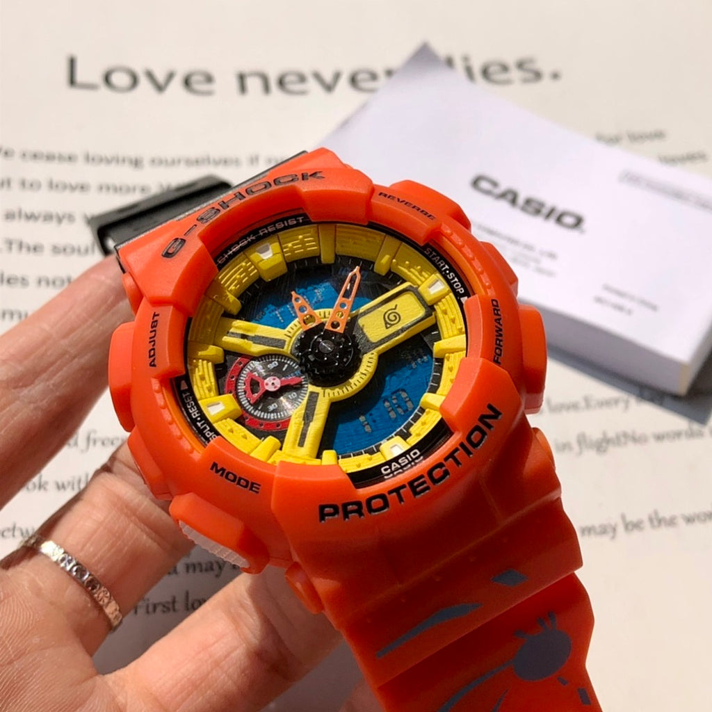 Orange G-Shock wristwatch worn on a hand, showing blue dial and yellow ring
