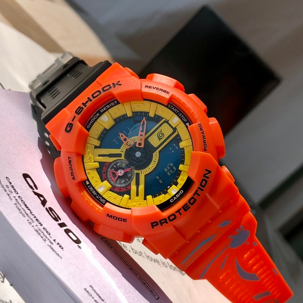 Orange G-Shock wristwatch with blue-and-yellow dial in protective case