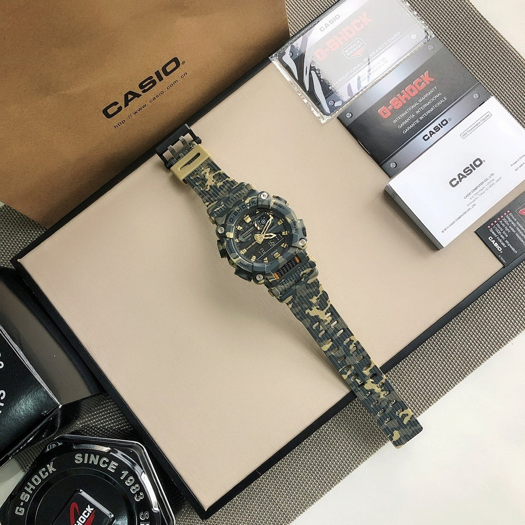 Blue camo sport digital watch on display box, gold-accented multi-dial face