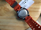 Casio watch caseback on red silicone strap with round silver back plate