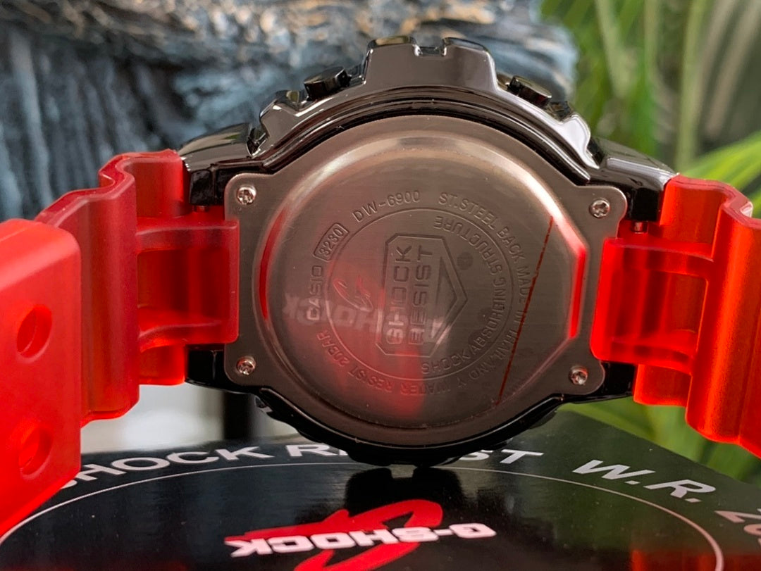 Casio G-Shock watch case back with red resin strap holders