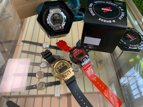 Casio G-Shock watch with black case and blue strap, with black digital face