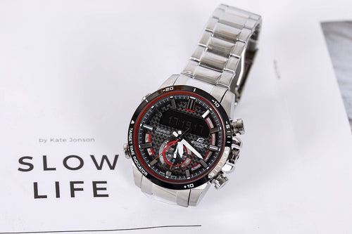 Casio wristwatch with silver metal bracelet and black dial with red details, angled view