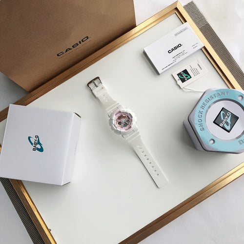 Casio watch with white resin strap shown with case and accessory card in view