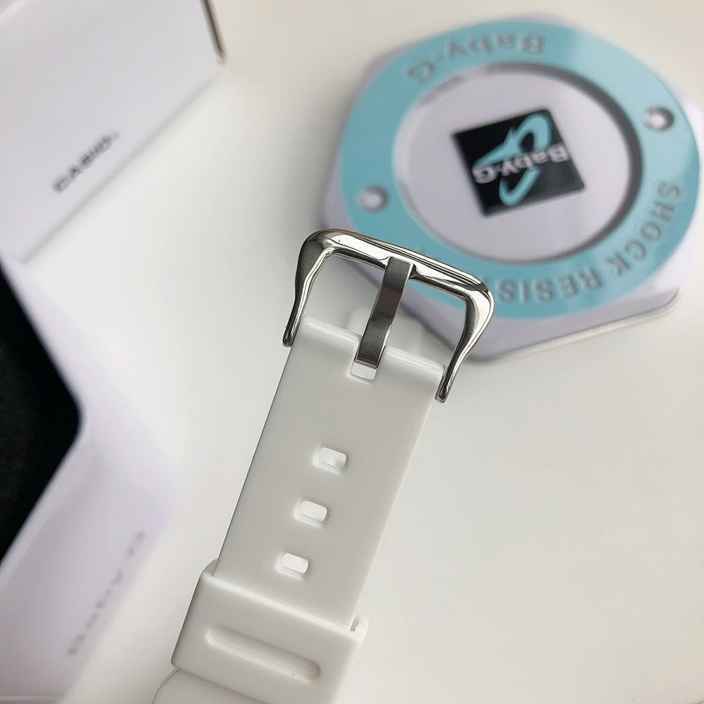 Casio watch with white resin strap and light blue case back showing display window