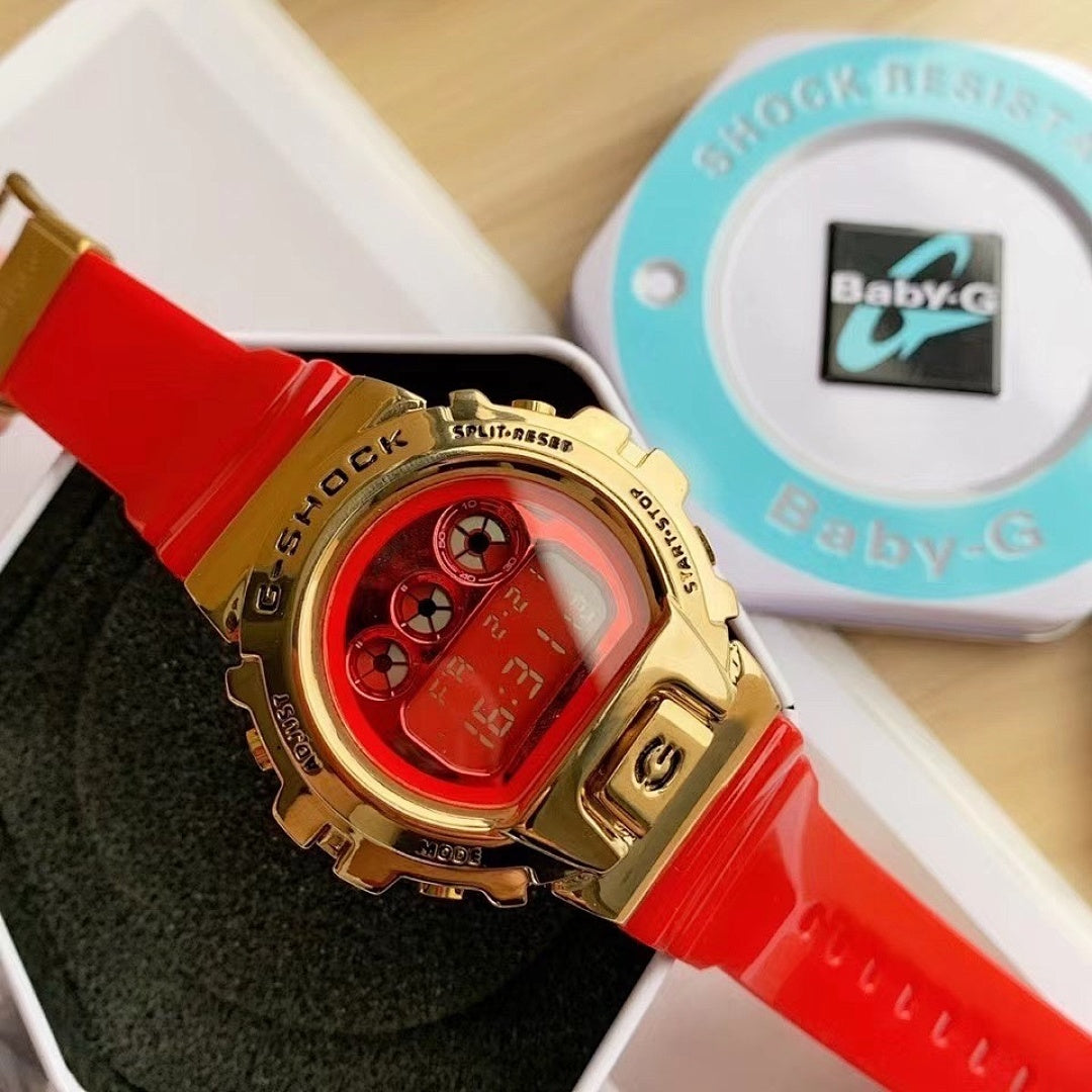 Casio watch with red resin strap and gold-tone bezel, red digital display