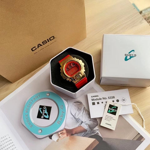 Casio watch in a gift box with red resin strap and gold-tone case