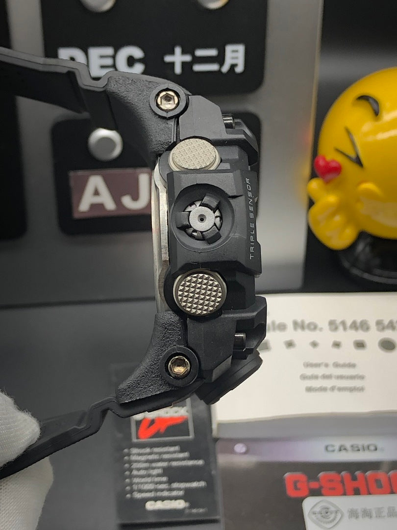 Casio G-Shock watch side with textured button and black strap