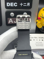Casio G-Shock watch buckle with PROTECTION marking on black strap