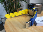 Casio G-Shock watch with yellow strap and blue clasp, silver case back