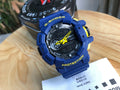 Casio G-Shock blue digital chronograph watch with yellow accents and blue strap