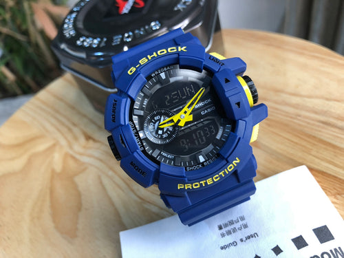 Casio G-Shock blue digital chronograph watch with yellow accents and blue strap