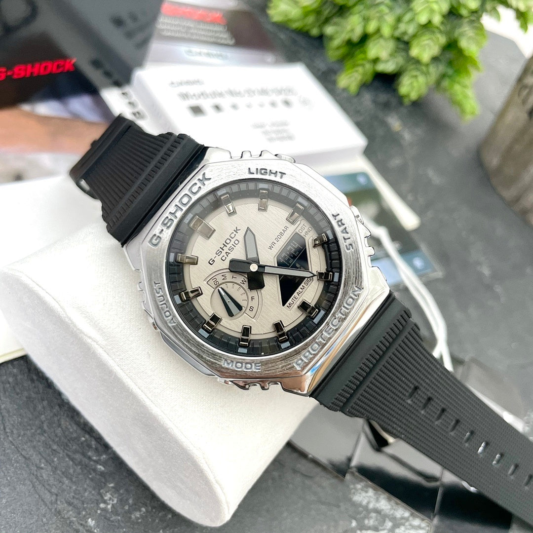 Casio G-Shock watch with black resin strap, light dial, silver bezel and buttons