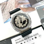 Casio G-Shock watch with black resin strap and silver case, light dial view