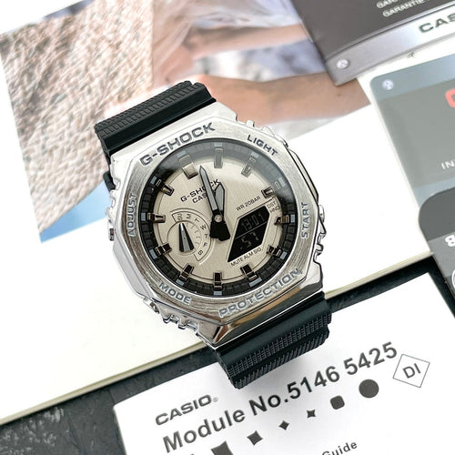 Casio G-Shock watch with black resin strap and silver case, light dial view