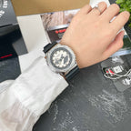 Casio G-Shock watch on wrist with black resin strap, light dial, silver bezel