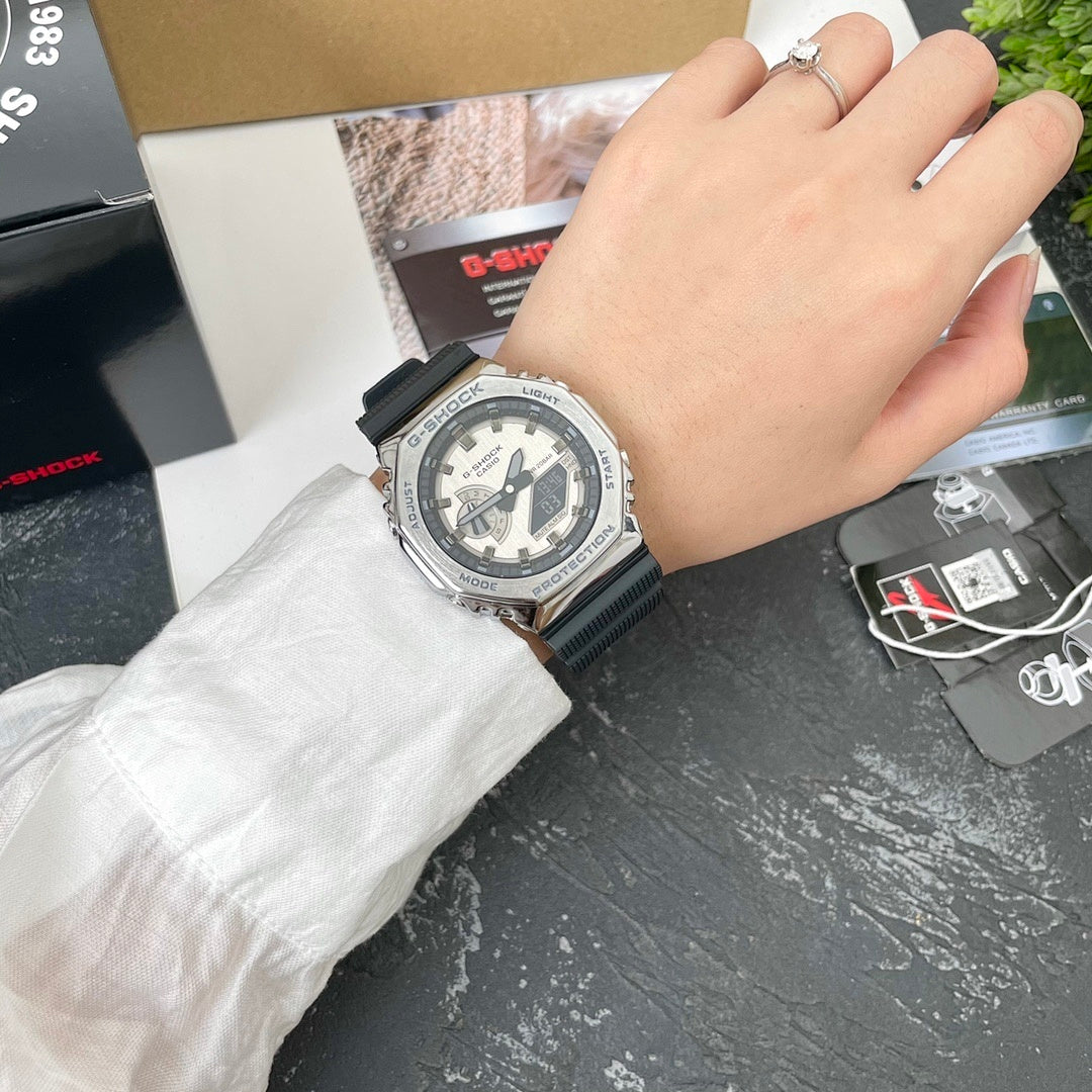 Casio G-Shock watch on wrist with black resin strap, light dial, silver bezel