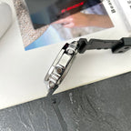 Casio G-Shock watch side view with black resin strap and silver metal buttons