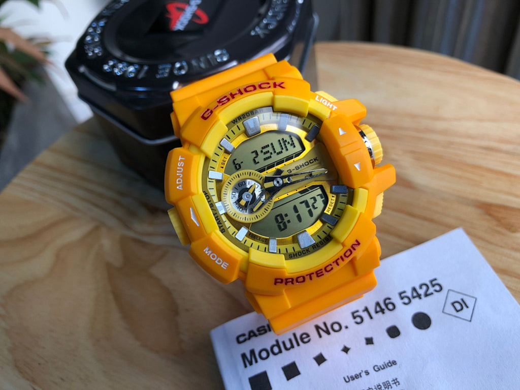 Casio watch with yellow resin strap and digital display