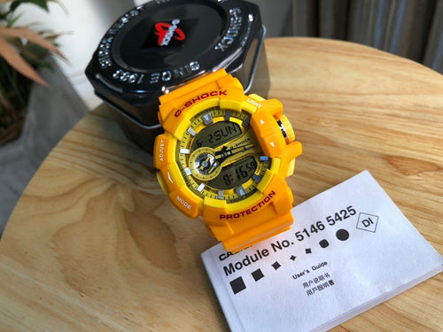Casio watch with yellow resin strap and round digital face