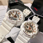 Casio watches with white resin straps and gold-toned multi-dial faces, side-by-side
