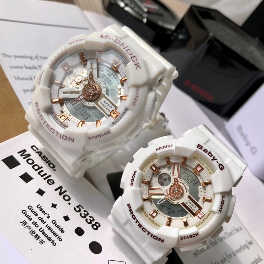 Casio watch pair with white resin straps and gold-toned multi-dial faces, boxed