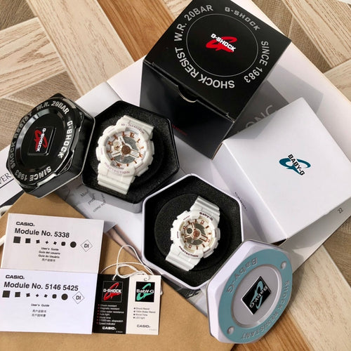 Casio watch set: white and dark-faced watches with resin straps in packaging