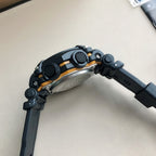 Casio G-Shock wristwatch side view with black and orange bezel
