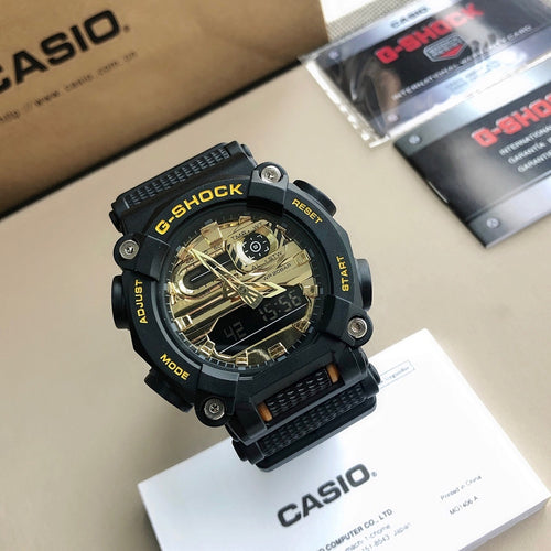 Casio G-Shock wristwatch with black resin strap and gold-toned dial face