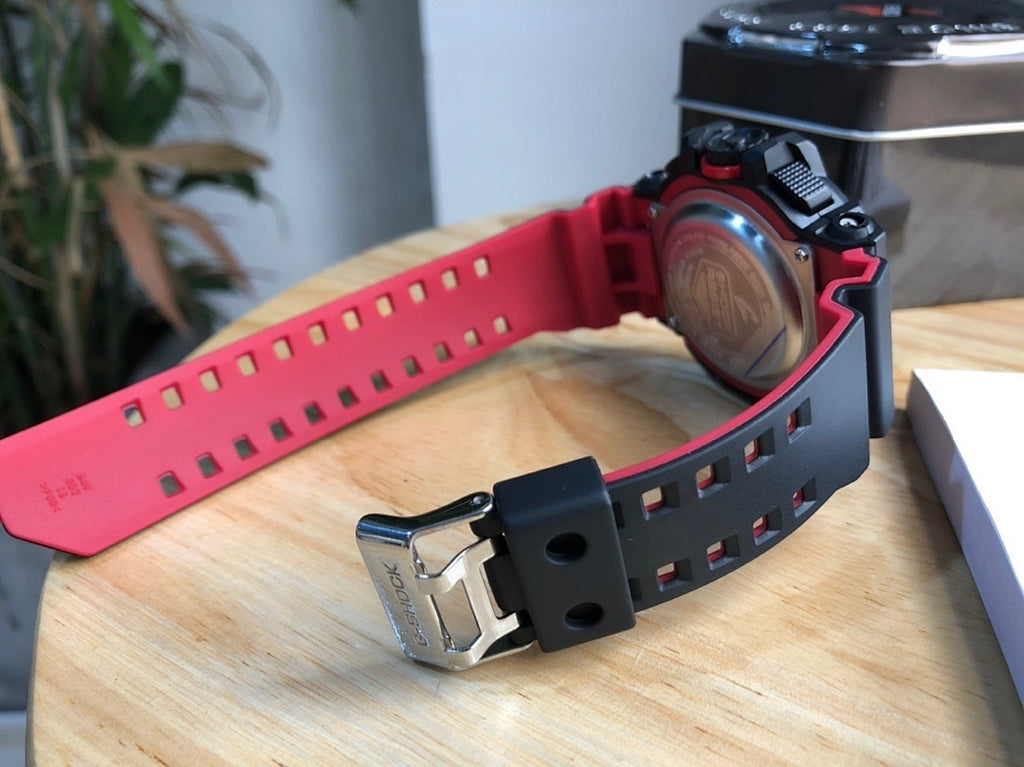 Casio G-Shock watch with red perforated strap and metal clasp
