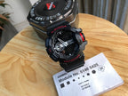 Casio G-Shock watch with black resin strap, red accents, round analog-digital face