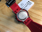 Casio G-Shock watch with red resin strap, round steel back and face