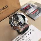 Casio G-Shock style wristwatch with black rubber strap and silver bezel, blue dial