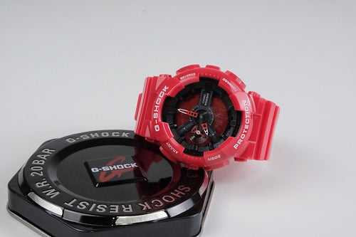 Casio G-SHOCK red digital watch, side view showing dial details and buttons
