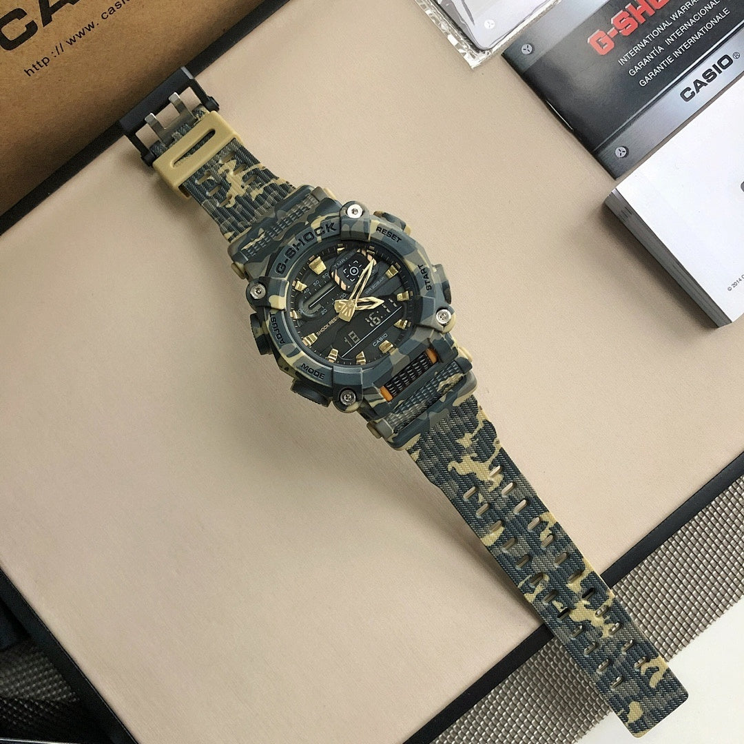 Camo resin G-Shock wristwatch with blue strap and black dial.